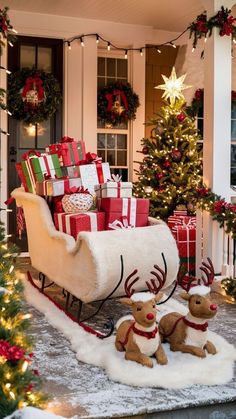 a sleigh filled with presents sitting next to a christmas tree in front of a house