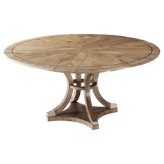 a round wooden table with two leaves on it