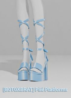 there is a woman's legs wearing blue and white high heeled shoes with laces on them