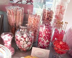 a table topped with lots of candy and candies