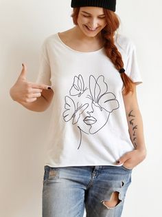 The cotton tee is the basic staple of any wardrobe. It is the foundation upon which casual fashion grows. The butterfly face design adds a feminine sparkle to this minimalistic t-shirt and gives it summer vibes. The specially spun fibers provide a smooth surface for premium printing vividness and sharpness. No side seams mean there are no itchy interruptions under the arms. The shoulders have tape for improved durability. .: 100% cotton (fiber content may vary for different colors) .: Medium fab Minimalist Crew Neck T-shirt, Modern T-shirt, Butterfly Face, Abstract Face, Face Design, T Shirt For Women, Shirt For Women, Butterfly Print, Summer Tshirts