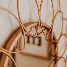 a close up of a clock on a wall with circles in the middle and numbers behind it