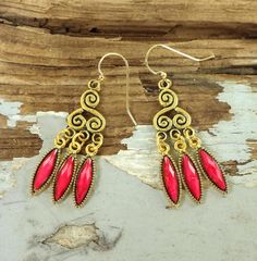 Hot pink chandelier earrings feature boho, tribal, scroll earring tops and fuchsia pointed oval dangles at the bottom. Earrings are 2 1/4 inches (57mm) long with gold plated brass earring wires. See all photos for size reference. ---------------------------------- I designed these earrings and will make a pair just for you. They will ship in a cotton filled jewelry box. ---------------------------------- Thank you for stopping by! Find more earring styles here - https://www.etsy.com/shop/CharleneSevier?ref=hdr_shop_menu&section_id=10358243  Enter my shop - https://www.etsy.com/shop/CharleneSevier?ref=hdr_shop_menu  Sign up for my newsletter! Copy and paste this link in your browser - https://lp.constantcontactpages.com/sl/guuquqO  Follow my shop to receive updates about new and restocked i Long Dangle Earrings Hot Pink, Pink Chandelier Earrings, Earring Tops, Pink Chandelier, Earring Styles, Magenta Flowers, Menu Sign, Earring Wires, Gold Filigree