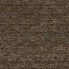 a brown and black textured wallpaper with small squares on the top, in an irregular pattern