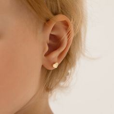 These finely crafted heart shaped earrings, are sure enough to brighten up your little girls day. A pair of 14k yellow gold screw back earrings that can fit securely in your little girls ears without causing discomfort. These beautiful heart earrings feature dainty clear cubic zirconia stones throughout one side to add more glimmering details. They are made of 14k yellow gold, a precious material which are suitable for little girls with sensitive ears. Gift box included. Age Group: Babies, Infan Earrings For Baby Girl, Toddler Earrings, Teen Jewelry, Girls Day, Boys Jewelry, Baby Earrings, Jewelry Lockets, Thread Earrings