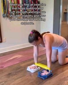 a woman kneeling down on the floor with a tool