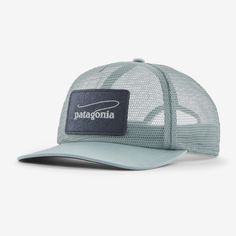 the patagonia trucker hat in light blue and white with a patch on the front