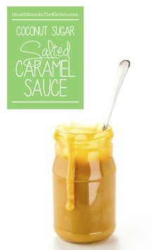 a jar filled with caramel sauce next to a spoon and sign that says coconut sugar called caramel sauce