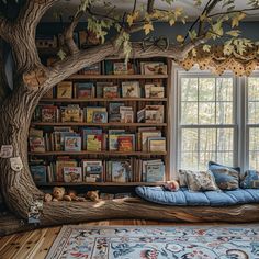 a living room with bookshelves and a tree in the corner that has been made into a reading nook