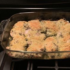 a casserole dish filled with meat and vegetables cooking in the stove top oven