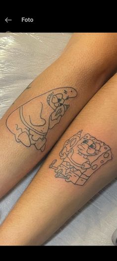 two people with tattoos on their legs sitting next to each other