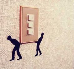 two silhouettes are shown as they pull up a light switch on the wall with one man