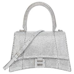 BALENCIAGA Rhinestone Embellished Suede Small Hourglass Serial Number: 593546-1272-R-562481 Age (Circa): 2022 Accompanied By: Balenciaga Dust Bag, Box, Care Booklet Authenticity Details: Date Stamp (Made in Italy) Gender: Ladies Type: Top Handle, Shoulder, Crossbody Colour: Silver Hardware: Silver Material(s): Suede, Rhinestone Interior: Black Leather Closure: Button Height: 15.5cm Width: 22.5cm Depth: 10cm Handle Drop: 10cm Strap Drop: 50cm Unworn Condition -This item is in unworn condition. At Balenciaga Crossbody Bag, Rhinestone Handbags, Butterfly Bags, Date Stamp, Slim Aarons, Balenciaga Bag, Chanel Black, Handbags Online, Small Handbags