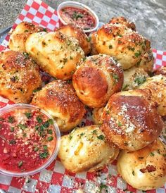 bread rolls and dips on a red checkered plate