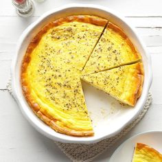 a quiche with one slice missing from it