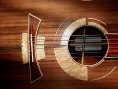 an acoustic guitar with the fret section cut out