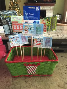 some toothpicks are in a basket on the counter next to a christmas tree