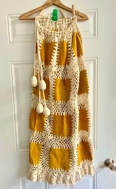 "Handmade leather suede squares crocheted together, with drawstring crocheted pull and 4 crocheted bon bons at end of drawstring. Owned by someone before that bought it at Neiman-Marcus in about 1975. Skirt is somewhat sophisticated rustic. Skirt is long. 40\" long about 25\" wide at bottom x waist less than 32. But if hips are bigger, allow for 32\" hips. Handmade possibly in another country. Seems to be in good shape." Crochet Baby Skirt, Yarn Skirt, Crochet Garments, Cozy Pattern, Crochet Skirt Pattern, Skirt Patterns, Quilted Skirt, Handmade Skirts, Small Crochet