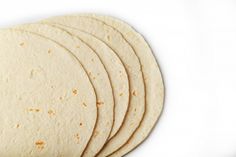 four tortillas are stacked on top of each other