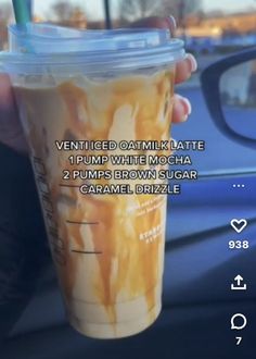 a person holding up a drink in front of a car with the caption'ventted oatmeal latte 1 pump while mocha 2 pumps brown sugar caramel, caramel, brizle