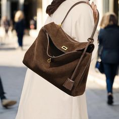 Discover our luxurious Suede Leather Tote Bag--the ultimate blend of style and practicality. Crafted from premium suede, this shoulder bag is soft to the touch, offering a timeless slouchy silhouette perfect for any occasion. 🌟 Available in beautiful shades of Caramel, Coffee, and Dark Brown, this bag comes in two versatile sizes to fit all your essentials: Small: 28 x 10 x 19 cm (11 x 3.9 x 7.5 in) Large: 35 x 11 x 23 cm (13.8 x 4.3 x 9.1 in) Looking for more? I have additional styles and colors available in high-quality suede and leather. Want extra photos or videos to make your choice easier? Just message me privately, and I'll be happy to share! 😊 Luxury Large Capacity Handheld Baguette Bag, Luxury Large Capacity Hobo Shoulder Bag, Large Capacity Clutch Shoulder Bag For Daily Use, Luxury Everyday Handheld Baguette Bag, Luxury Fall Hobo Bag For Everyday, Elegant Large Capacity Baguette Bag For Travel, Elegant Fall Tote Baguette Bag, Elegant Baguette Bag With Large Capacity For Travel, Elegant Fall Baguette Tote Bag