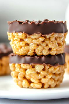 three chocolate covered macaroni and cheese treats stacked on top of eachother