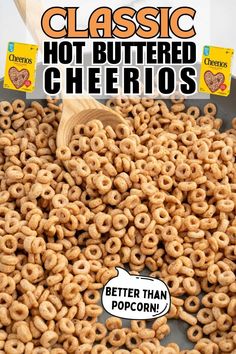 a wooden spoon full of cheerios sitting on top of a pan