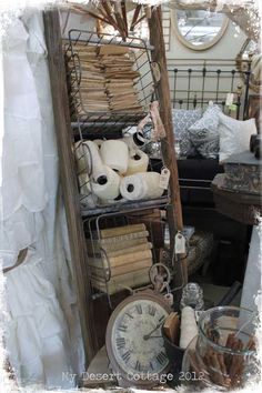 a shelf filled with lots of different types of cloths and other items on top of it