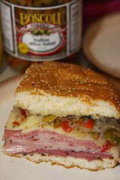 a sandwich cut in half sitting on top of a white plate