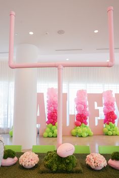 pink and green decorations in the shape of footballs