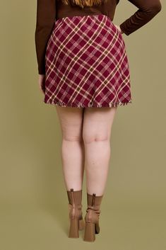 Make a bold statement with the Teagan Plaid Mini Skirt in Burgundy. Bias plaid pattern and frayed hem add a touch of edge to this stylish mini skirt. Perfect for a night out or a day at the office. Dare to stand out with Teagan! Mini Skirt Plus Size, Skirt Plus Size, Plus Size Jumpsuit, Sweater Tank Top, Plaid Mini Skirt, Plus Size Sweaters, Fall Wardrobe, Red Plaid, Plus Size Tops