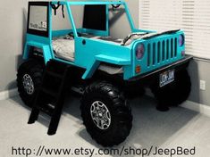 a blue jeep bed in the corner of a room