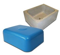 two blue and white containers sitting next to each other on a white surface with one container in the shape of a rectangle