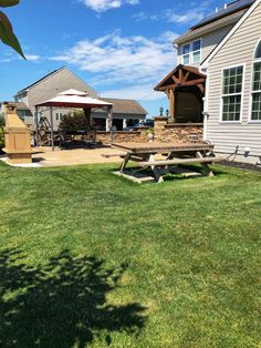 a picnic table in the middle of a yard