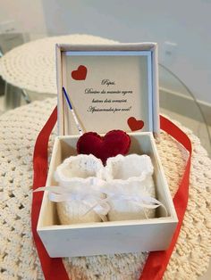 an open box with two hearts in it