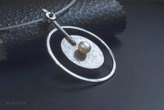 Large geometric necklace silver round pendant. Α well balanced geometric necklace made out of fine Sterling, and natural freshwater Pearl. Height: 2.36'' Width: 1.77'' Chain's length: 16.53'' Here are the matching earrings: https://www.etsy.com/listing/258131115/silver-stud-earrings-fresh-water-pearls?ref=shop_home_active_79&sca=1 Get a 10% discount off your next order by subscribing at Diapiro's newsletter. Link for coupon code https://mailchi.mp/56f529763263/diapiro All of my products are Modern Handmade Pearl Jewelry, Modern Sterling Silver Pearl Necklace Gift, Modern Silver Pearl Necklace With Pearl Drop, Modern Silver Jewelry With Pearl Drop, Modern Silver Necklace With Pearl Pendant, Modern Silver Pearl Necklace With Charm, Modern Pearl Pendant Necklace, Minimalist Silver Metal Pearl Necklace, Silver Minimalist Pearl Necklace