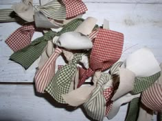 several pieces of fabric tied together on top of each other with ribbons attached to them