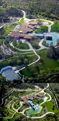 an aerial view of a large home surrounded by lush green trees and bushes, with a pool in the middle