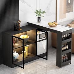 a black and white table with shelves on the side in a living room next to a couch