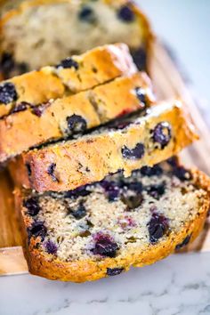 slices of blueberry bread on a cutting board