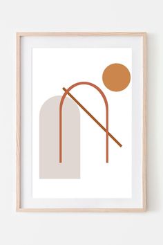 a framed art print with an orange and brown design on the wall next to a wooden frame