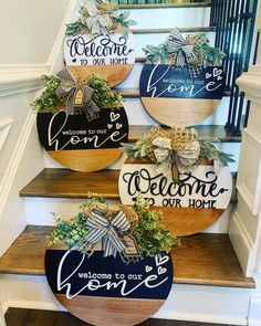 three wooden signs with welcome to our home written on them