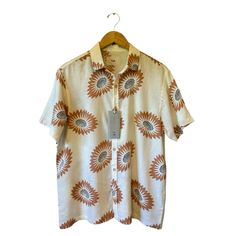 Folk Men’s Drake Short Sleeve Shirt Style: “Drake” Short Sleeve Color: Ecru With Terra Cotta And Black Floral Pattern Fabric: 55% Linen, 45% Viscose Size: Small Chest: 22.5” Across, Laid Flat Waist: 23” Across Shoulders: 18.5” Shoulder Seam To Seam Length: 28” Detail: British Modern Style Button Front Collared Neckline Breathable Lightweight Fabric New With Tags. White Linen Shirt With Floral Print, Collared Cream Shirt For Summer, Cream Short Sleeve Workwear Shirt, Casual Cream Shirt With Spread Collar, Cream Collared Shirt For Summer, Summer Cream Collared Shirt, Casual Cream Summer Shirt, Short Sleeve Linen Shirt With Floral Print, Cream Spread Collar Top For Summer