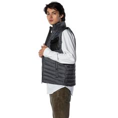 The Men's Puffer Vest Jacket from Members Only is perfect for chilly days. This jacket is made of 85% polyester and 15% down feathers, creating a soft and warm layer. It has a chest pocket with a button closure and a logo, and two waist pockets with buttons. The collar can be popped up for extra warmth. The jacket has a slim fit that flatters your figure and complements any outfit. Puffer Vest Jacket, Mens Puffer Vest, Popped Collar, Yearbook Pictures, Members Only Jacket, Trendy Winter, Members Only, It's Cold, Puffer Vest