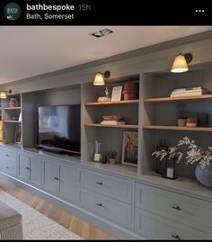 a living room filled with lots of gray furniture