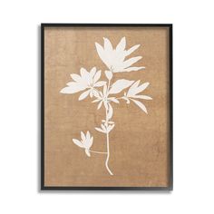 a white flower on brown paper in a black frame