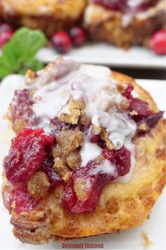 A giant cinnamon roll topped with icing, cranberries, and walnut, with small bowls of cranberries in the background. Store Bought Cinnamon Rolls, Cranberry Orange Sauce, Cranberry Cinnamon, Pecan Topping, Sugared Pecans, Orange Sauce, Incredible Recipes, Cranberry Orange, Favorite Comfort Food