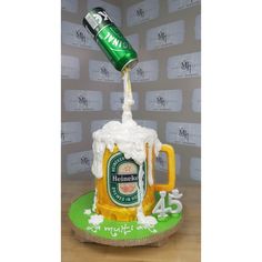 a cake made to look like a beer mug being poured into the top of it