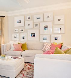 a living room filled with lots of furniture and pictures on the wall above it's coffee table