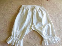 "Beautiful white cotton/linen blend,  antique bloomers or pantaloons - size medium or large, cut out of the inseam for ease of toiletry.  Monogrammed RC in white script. Nice generous scalloped lace on the bottom. I think the bottom were supposed to be seen a little above the boots....because they are so fancy...Nice mother of pearl buttons on each side with draw string for tightening. Measurements: approx 32\" tall from waist to bottom of lace, waist measures approx 32\"\" but it can be tighten White Cotton Short Bloomers, Daywear Cotton Bloomers With Ruffles, Cotton Bloomers With Ruffles For Daywear, Vintage Stretch Cotton Bottoms, Vintage White Cotton Bottoms, Vintage White Bottoms For Daywear, Vintage Stretch Bottoms For Daywear, Vintage Cotton Bottoms For Daywear, Vintage Bloomers